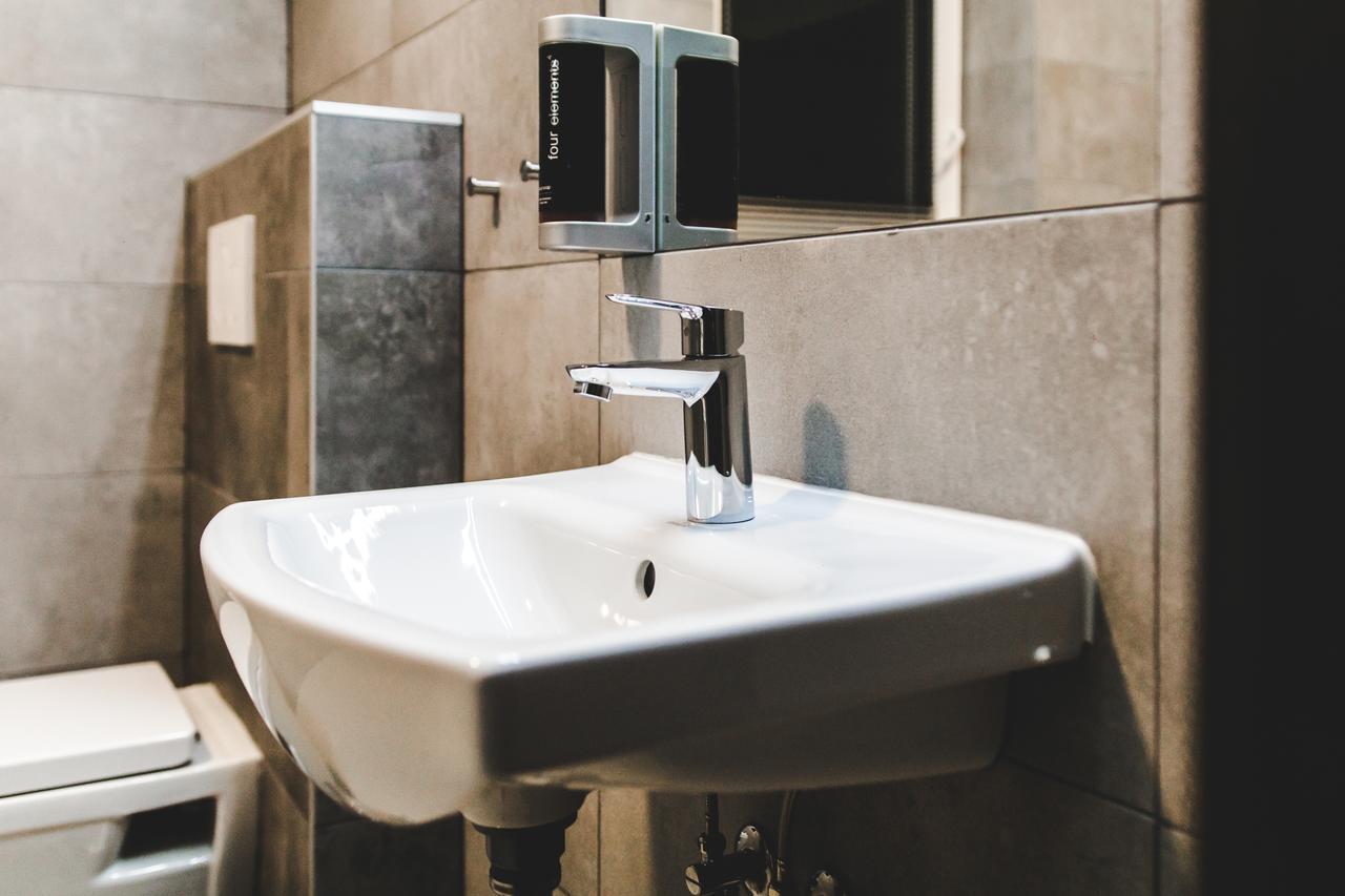 Silesia Residence 俄斯特拉发 外观 照片 A soap dispenser mounted above a sink